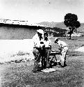 Dr. Charles Goff taking anthropological measurements on Zaculeu workmen.