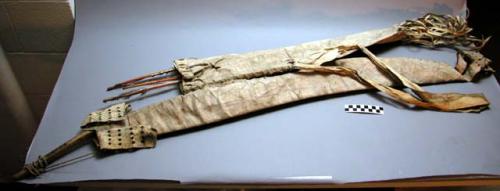 Bow, quiver and 3 arrows. Fringed rawhide. Sinew-wrapped bow.