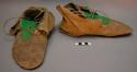 Pair of moccasins with green flannel bib, old