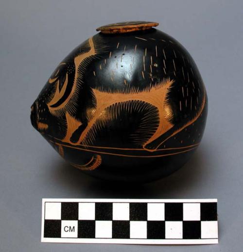 Carved gourd container with stopper - painted black, yellow, green & purple, pig