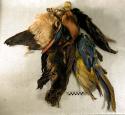 Necklaces or bandoleers with feathers attached