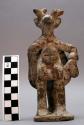 Pottery figurine - in costume of Deer Dancer