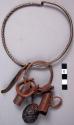 Iron necklet with iron bells, pendant, rings and nut