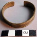Girl's bracelet made from trade brass - incised geometric decoration