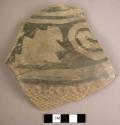 Large restored potsherd - black on grey with corrugation