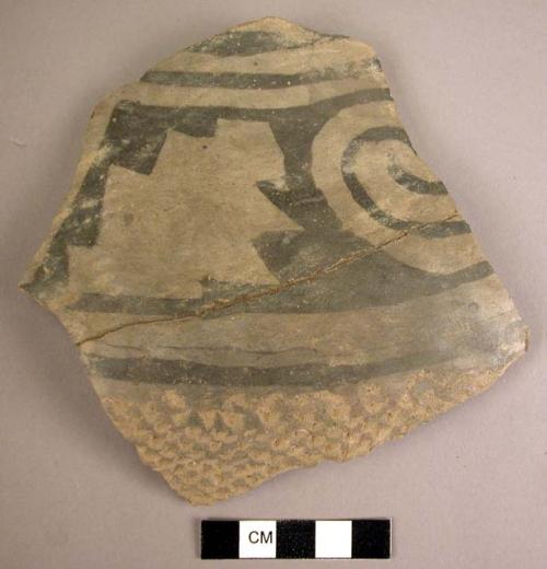 Large restored potsherd - black on grey with corrugation