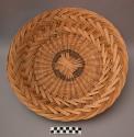Basket, wicker work, circular, flat base, flared sides, scalloped rim