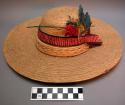 Straw hat. Plain, stiff straw hat worn by men. Hat originally had group of color