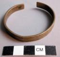 Girl's bracelet made of trade brass - incised geometric decoration