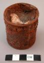 Round iron container filled with medicine to catch Witch