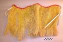Fringed skirt stained with turmeric