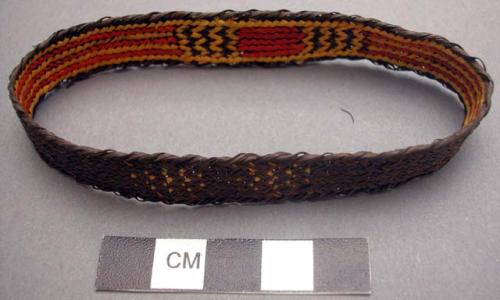 Basketry arm band - dark brown with red & yellow design