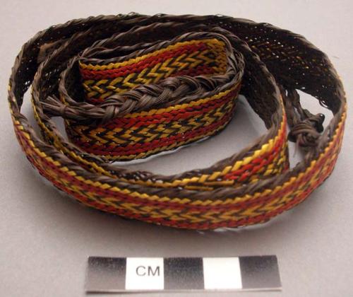 Basketry belt - brown with red and yellow designs