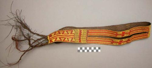 Wide basketry belt with slits at sides - brown with red & yellow design