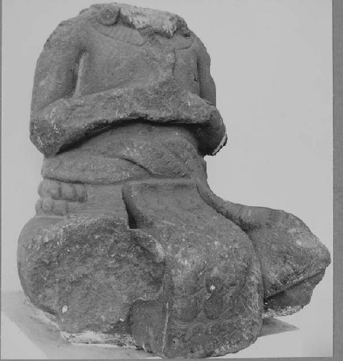 Sculptured stone - seated human figure