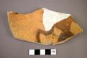 Zoomorphic potsherd (body outline with incised line--"mae west"