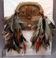 Mask of rawhide - bands of light & dark brown fur on front; roll of +