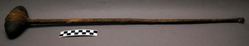 Club with stone head hafted w/ rawhide thongs to rawhide covered wooden shaft