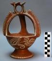 Pottery basket. red ware, white painted decoration. 24 cm. tall, 17 cm. max. dia