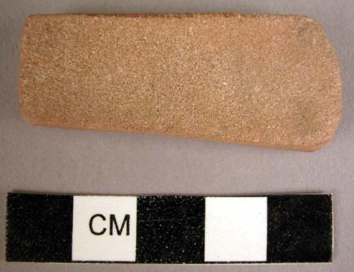 Stone, ground stone axe or rubbing stone, trapezoidal, small, flat