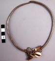Iron necklet with cowrie, button, horn and tooth pendants