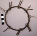 Spiral brass wire bracelet with brass pendants