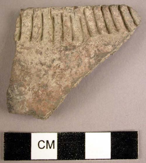 Plain ware potsherd with incised decoration