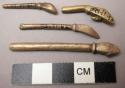 Cast brass or bronze miniature axe, broken