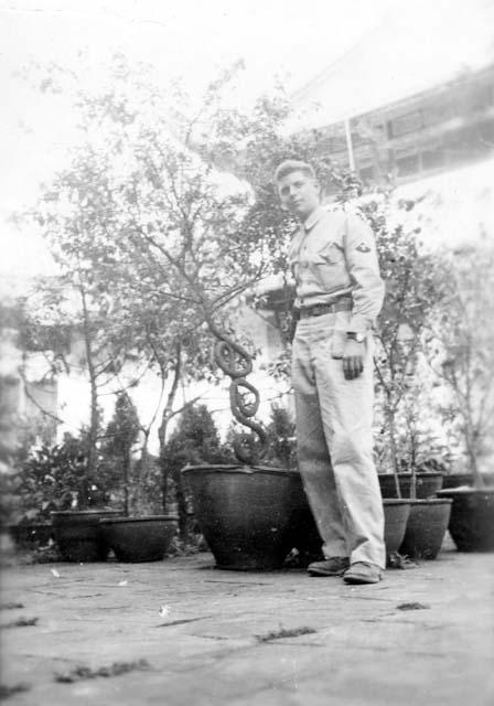 Fener in front of plants; titled "Temple garden self portrait"