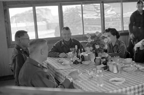 Four Military Men: One Military Woman; Table; Food