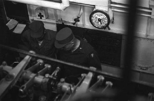 General William S. Whitcomb and another American soldier aboard a vessel