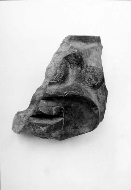 Fragment of stone vessel, death's head.