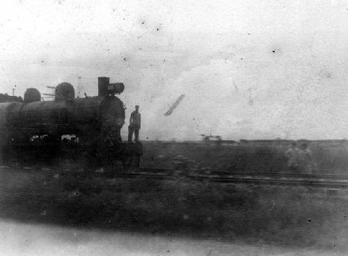 Man standing on locomotive