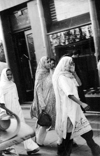 Indian women walking on sidewalk; titled "Indian Foreigner's [sic]"