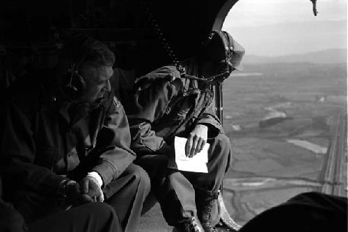 Two Military Men; Headphones; Landscape