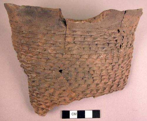 Part of large indented corrugated jar