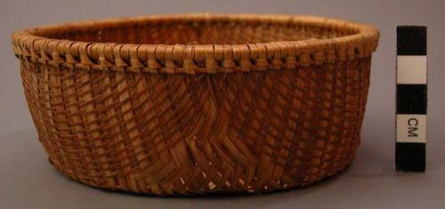 Basket, twilled, convex base, straight sides, flat rim