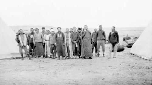 Group of people between tents