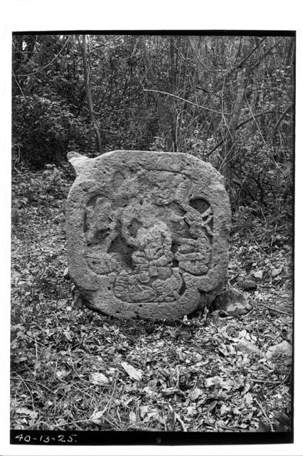 Sculptured stone disk / altar with seated figures