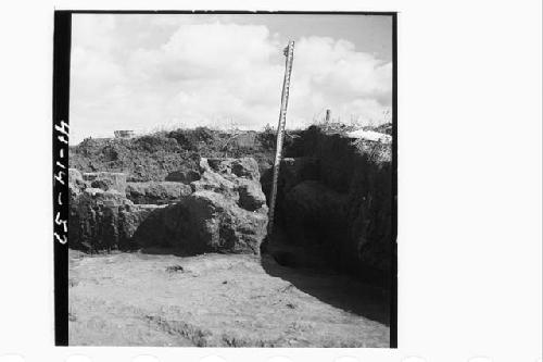 Section N97.13E from W.  Center: talpetate rocks and adobe debris, one piece of