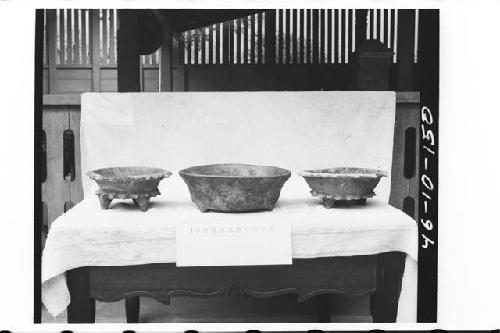 Three pottery vessels from tomb in ball court