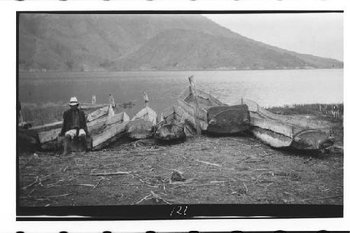 Dugout canoes; Chuitinamit in Background at Foot of Volcan San Pedro