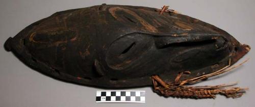 Wooden mask with wicker work on lower half of sides