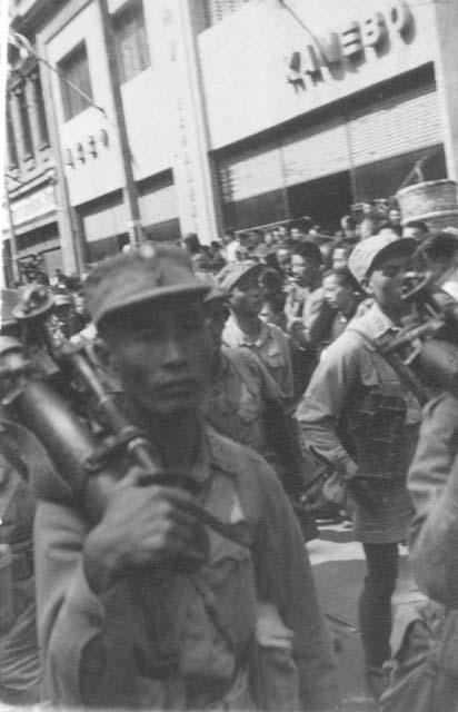 Soldiers in parade; titled "Troops on celebration"