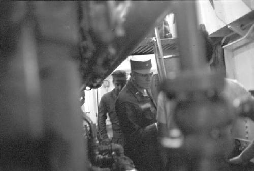 General William S. Whitcomb and other soldier in ship hull