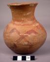 Pottery jar with red painted decoration