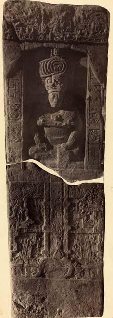 Stela 11 broken in two pieces, showing a god