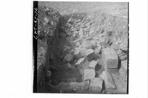 Fallen squared stones of exterior E wall.  Mound 8-E.