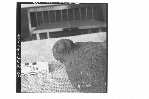 Tripodal Stone Metate with Small Stone Head Ornament at One End