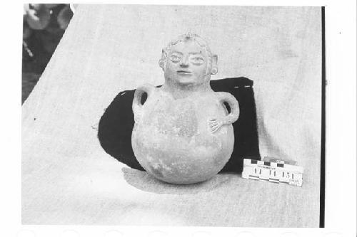 Pottery Jar and Human Face on Neck of Vessel